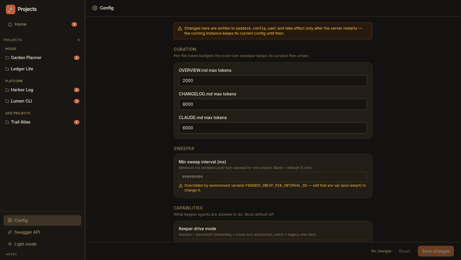 Paddock's instance Config screen editing paddock.config.yaml, with a restart-to-apply banner and grouped curation, sweeper and capability fields