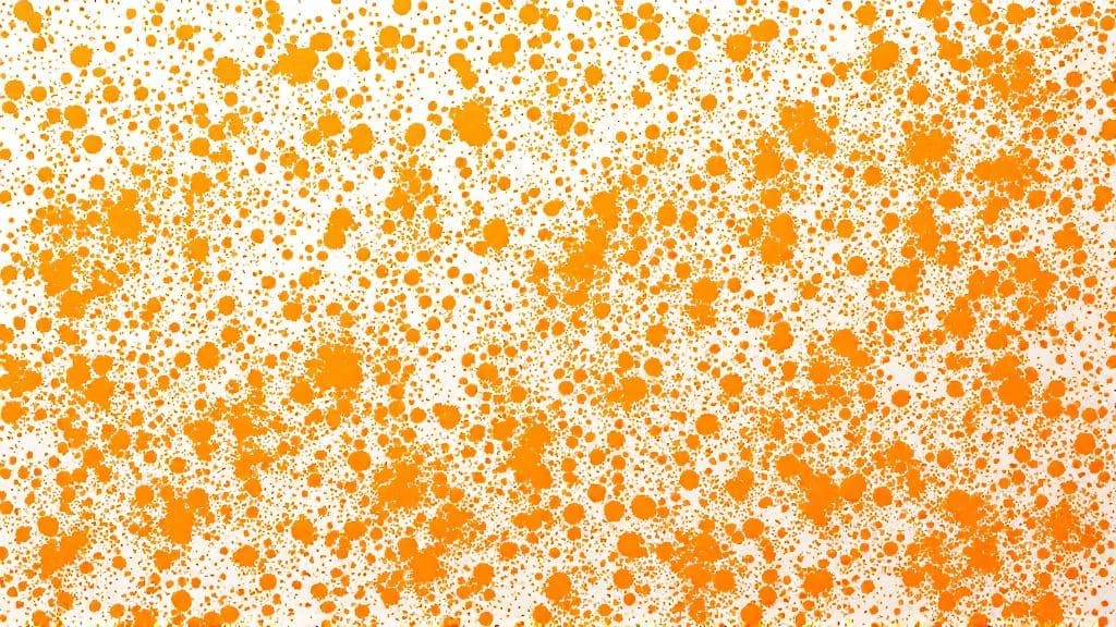 Paintball splatters on a white wall