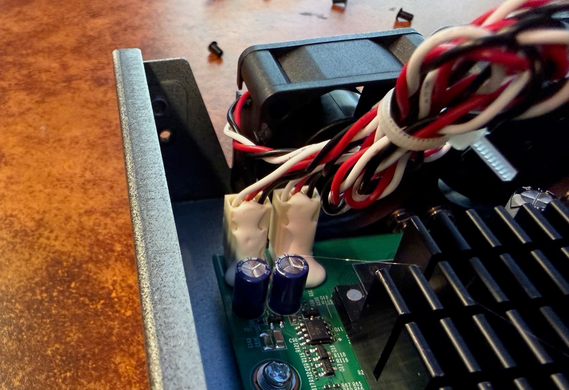 The fan power cable is glued to the header